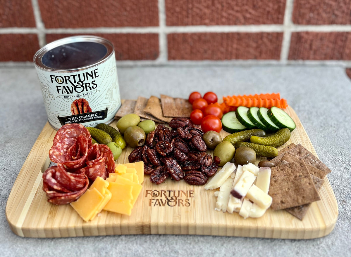 Fortune Favors The Classic Featured on Charcuterie board with meats, cheeses, pickles and veggies