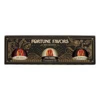 Black and gold sampler gift pack containing three 8 ounce cans of Fortune Favors candied pecans, one of each signature flavor.