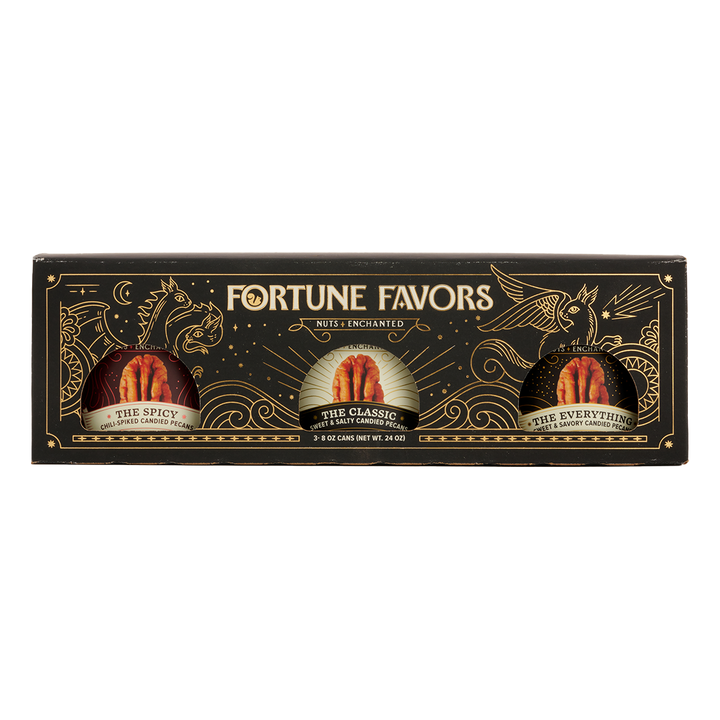 Black and gold sampler gift pack containing three 8 ounce cans of Fortune Favors candied pecans, one of each signature flavor.